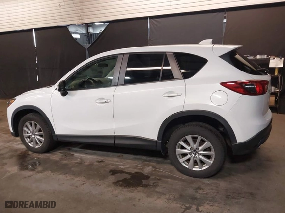 2015 Mazda CX-5 Touring with VIN JM3KE4CY4F0509530, listed as a IAAI auction lot 41858134 with 102,360 mi miles. Bid and sale history available at carsss.com. Image 14.
