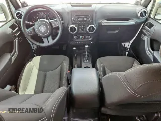 2014 Jeep Wrangler Unlimited Sahara with VIN 1C4BJWEG5EL309502, listed as a Copart auction lot 61804885 with 60,683 mi miles and Salvage title. Bid and sale history available at DreamBid. Image 8.