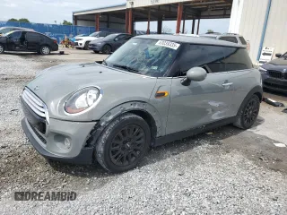 2014 MINI Hardtop with VIN WMWXM5C51ET934047, listed as a Copart auction lot 63039335 with 104,446 mi miles and Salvage title. Bid and sale history available at DreamBid. Image 1.
