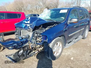 2003 GMC Envoy SLT with VIN 1GKDT13S732268164, listed as a IAAI auction lot 41863800 with 100,702 mi miles. Bid and sale history available at carsss.com. Image 2.