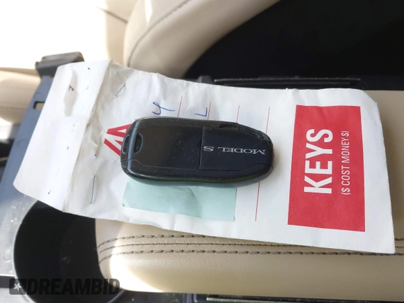 2014 Tesla Model S 60 with VIN 5YJSA1H1XEFP34226, listed as a IAAI auction lot 41806604 with 216,021 mi miles and . Bid and sale history available at DreamBid. Image 11.