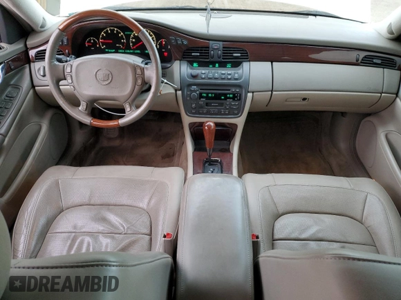 2004 Cadillac DeVille DTS z VIN 1G6KF57944U122824, wystawiony jako Copart lot #86147994 z przebiegiem 118 156 mil mil oraz Szkody całkowita. Historia ofert i sprzedaży dostępna na DreamBid. Obrazek 8.