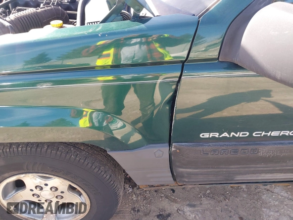 1997 Jeep Grand Cherokee Laredo with VIN 1J4GZ58S2VC595442, listed as a IAAI auction lot 41772133 with 229,764 mi miles. Bid and sale history available at carsss.com. Image 13.