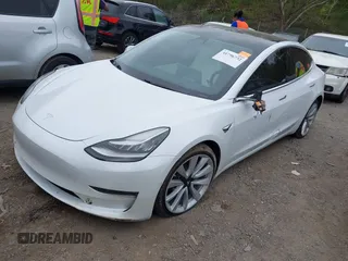 2020 Tesla Model 3 Long Range with VIN 5YJ3E1EB0LF703733, listed as a IAAI auction lot 41796732 with 75,027 mi miles. Bid and sale history available at carsss.com. Image 2.