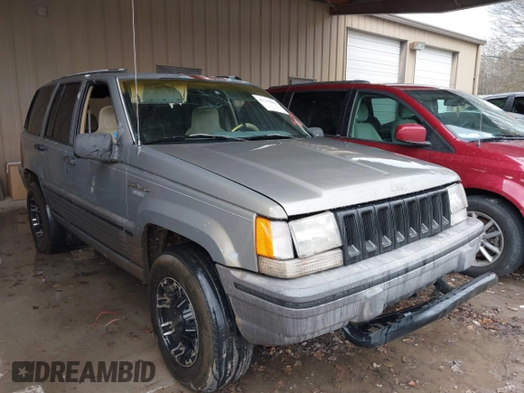 1995 Jeep Grand Cherokee Laredo with VIN 1J4GZ58SXSC697003, listed as a IAAI auction lot 41259889 with 248,595 mi miles. Bid and sale history available at carsss.com. Image 1.
