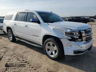 2017 Chevrolet Suburban Premier with VIN 1GNSCJKCXHR348044, listed as a Copart auction lot 55957535 with 112,131 mi miles and Salvage title. Bid and sale history available at DreamBid. Image 4.