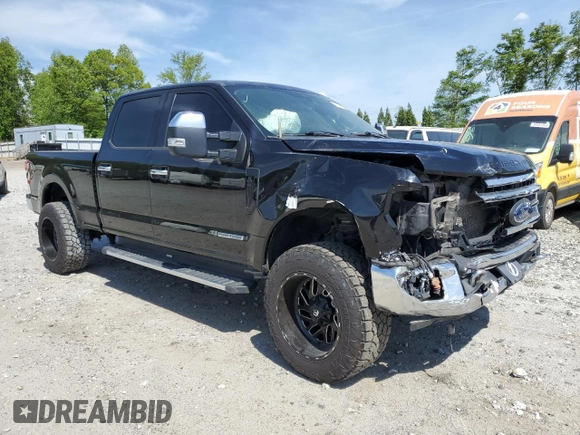 2021 Ford Super Duty F-250 SRW XL with VIN 1FT7W2BT1MEC51277, listed as a Copart auction lot 54199165 with 99,324 mi miles and Salvage Title. Bid and sale history available at carsss.com. Image 4.