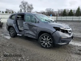 2020 Honda Pilot Touring 7-Passenger with VIN 5FNYF6H60LB039609, listed as a Copart auction lot 51753425 with 57,512 mi miles and Salvage title. Bid and sale history available at DreamBid. Image 4.