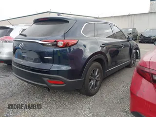 2021 Mazda CX-9 Touring with VIN JM3TCACY9M0526880, listed as a IAAI auction lot 42310923 with 25,991 mi miles and . Bid and sale history available at DreamBid. Image 4.