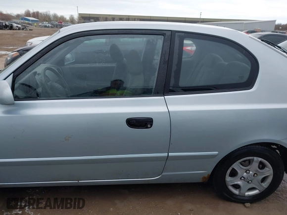 2003 Hyundai Accent GL with VIN KMHCG35C23U264360, listed as a IAAI auction lot 42033316 with 100,991 mi miles. Bid and sale history available at carsss.com. Image 14.