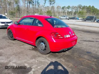 2012 Volkswagen Beetle 2.5L PZEV with VIN 3VWJP7AT0CM649068, listed as a IAAI auction lot 41684217 with 135,829 mi miles. Bid and sale history available at carsss.com. Image 3.