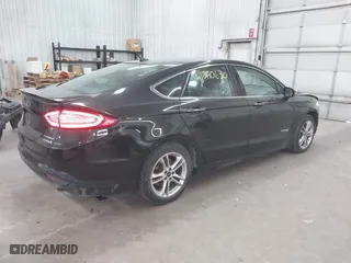 2015 Ford Fusion Titanium Hybrid with VIN 3FA6P0RU2FR309074, listed as a IAAI auction lot 41240630 with 172,025 mi miles. Bid and sale history available at carsss.com. Image 4.