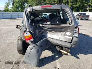 2004 Ford Escape XLS with VIN 1FMYU92134KA21707, listed as a Copart auction lot 72114804 with 219,518 mi miles and Salvage Title. Bid and sale history available at DreamBid. Image 6.