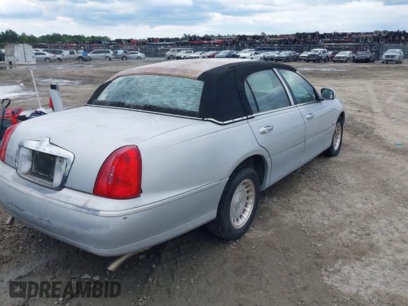 1998 Lincoln Town Car Signature with VIN 1LNFM82WXWY659028, listed as a IAAI auction lot 42265774 with 164,400 mi miles and . Bid and sale history available at DreamBid. Image 4.
