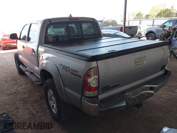 2014 Toyota Tacoma with VIN 3TMLU4EN3EM162738, listed as a IAAI auction lot 41871226 with 135,318 mi miles and . Bid and sale history available at DreamBid. Image 3.