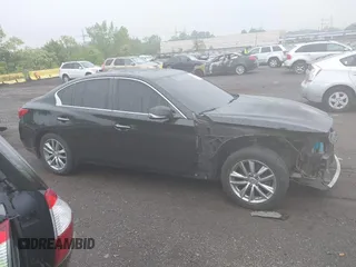 2014 Infiniti Q50 Premium z VIN JN1BV7AR2EM705630, wystawiony jako IAAI lot #42258650 z przebiegiem 109 151 mil mil oraz . Historia ofert i sprzedaży dostępna na DreamBid. Obrazek 13.