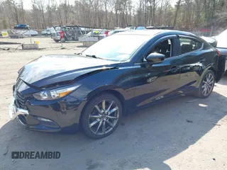 2018 Mazda 3 Touring with VIN 3MZBN1V34JM261565, listed as a IAAI auction lot 41795238 with 121,112 mi miles. Bid and sale history available at carsss.com. Image 18.