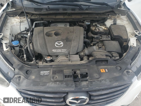 2016 Mazda CX-5 Sport with VIN JM3KE2BY0G0729349, listed as a Copart auction lot 62469735 with 88,247 mi miles and Salvage title. Bid and sale history available at DreamBid. Image 12.