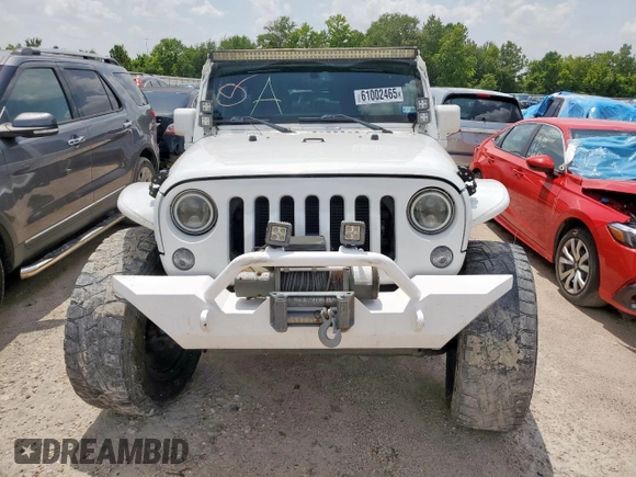 2015 Jeep Wrangler Unlimited Sport with VIN 1C4BJWDG9FL759012, listed as a Copart auction lot 61002465 with 101,395 mi miles and Salvage title. Bid and sale history available at DreamBid. Image 5.