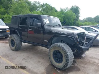 2013 Jeep Wrangler Unlimited Rubicon with VIN 1C4BJWFG5DL652050, listed as a IAAI auction lot 42451954 with 107,110 mi miles and . Bid and sale history available at DreamBid. Image 1.