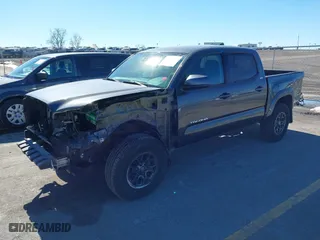 2019 Toyota Tacoma 4WD SR with VIN 3TMCZ5AN9KM275537, listed as a IAAI auction lot 41694037 with 102,933 mi miles. Bid and sale history available at carsss.com. Image 19.