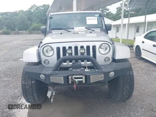 2016 Jeep Wrangler Unlimited Sahara with VIN 1C4BJWEG5GL117872, listed as a IAAI auction lot 42692798 with 119,819 mi miles and . Bid and sale history available at DreamBid. Image 12.