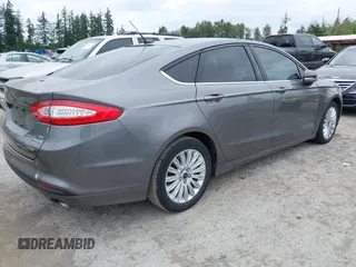 2014 Ford Fusion SE Hybrid with VIN 3FA6P0LU6ER285188, listed as a IAAI auction lot 42516215 with 122,899 mi miles and . Bid and sale history available at DreamBid. Image 4.