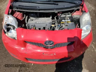 2009 Toyota Yaris with VIN JTDKT903095246576, listed as a Copart auction lot 52150915 with 90,276 mi miles and Salvage Title. Bid and sale history available at DreamBid. Image 11.