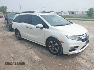 2018 Honda Odyssey Touring z VIN 5FNRL6H87JB005100, wystawiony jako IAAI lot #42379881 z przebiegiem 133 956 mil mil oraz . Historia ofert i sprzedaży dostępna na DreamBid. Obrazek 1.