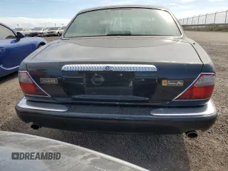 1999 Jaguar XJ with VIN SAJKX6047XC861227, listed as a Copart auction lot 75007414 with Not provided miles and Salvage title. Bid and sale history available at DreamBid. Image 6.