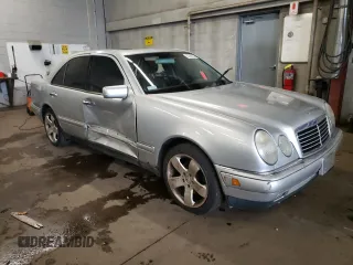 1999 Mercedes-Benz E-Class with VIN WDBJF82H4XX021888, listed as a Copart auction lot 83069274 with 173,198 mi miles and Salvage Title. Bid and sale history available at carsss.com. Image 4.