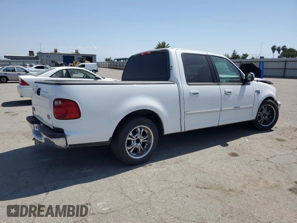 2001 Ford F-150 XLT with VIN 1FTRW07651KC49772, listed as a Copart auction lot 59904815 with 145,639 mi miles and Salvage title. Bid and sale history available at DreamBid. Image 3.