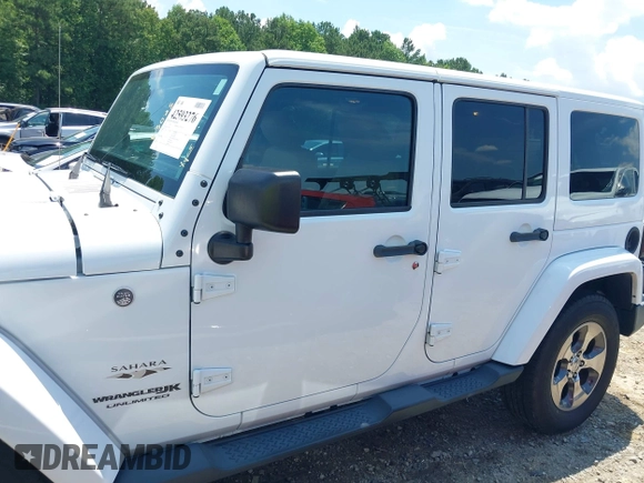 2018 Jeep Wrangler Unlimited Sahara with VIN 1C4BJWEG3JL805263, listed as a IAAI auction lot 42593276 with 96,489 mi miles and . Bid and sale history available at DreamBid. Image 14.