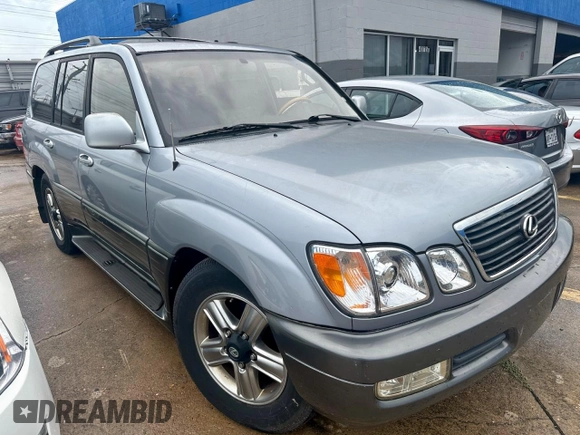 2001 Lexus LX 470 z VIN JTJHT00W313508801, wystawiony jako Copart lot #60938545 z przebiegiem 118 013 mil mil oraz Czysty tytuł • Clean title. Historia ofert i sprzedaży dostępna na DreamBid. Obrazek 1.