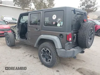 2014 Jeep Wrangler Unlimited Sport with VIN 1C4BJWDG7EL244749, listed as a IAAI auction lot 41871127 with 128,420 mi miles and . Bid and sale history available at DreamBid. Image 3.