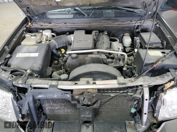 2005 GMC Envoy SLT z VIN 1GKDT13S652287033, wystawiony jako Copart lot #52508925 z przebiegiem 170 434 mil mil oraz Szkoda całkowita • Salvage title. Historia ofert i sprzedaży dostępna na DreamBid. Obrazek 13.