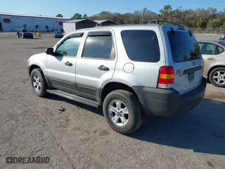 2006 Ford Escape XLT with VIN 1FMCU03166KB47650, listed as a IAAI auction lot 41529751 with 153,962 mi miles. Bid and sale history available at carsss.com. Image 3.