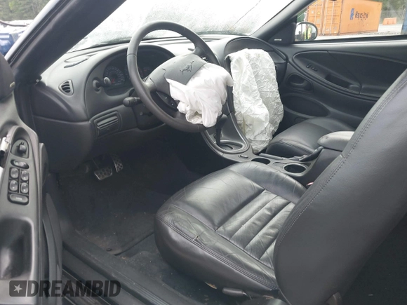 2004 Ford Mustang GT Deluxe z VIN 1FAFP45X64F104911, wystawiony jako IAAI lot #42025366 z przebiegiem 78 686 mil mil oraz . Historia ofert i sprzedaży dostępna na DreamBid. Obrazek 5.