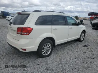 2013 Dodge Journey SXT with VIN 3C4PDDBG1DT619798, listed as a Copart auction lot 51820685 with 209,404 mi miles and Salvage Title. Bid and sale history available at DreamBid. Image 3.