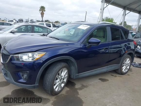 2014 Mazda CX-5 Grand Touring with VIN JM3KE2DY1E0307911, listed as a IAAI auction lot 42064898 with 133,934 mi miles. Bid and sale history available at carsss.com. Image 15.
