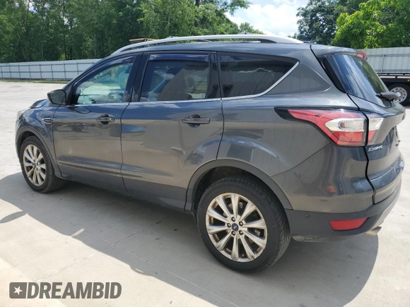 2018 Ford Escape Titanium with VIN 1FMCU0J93JUB20136, listed as a Copart auction lot 56841065 with 129,954 mi miles and Salvage title. Bid and sale history available at DreamBid. Image 2.