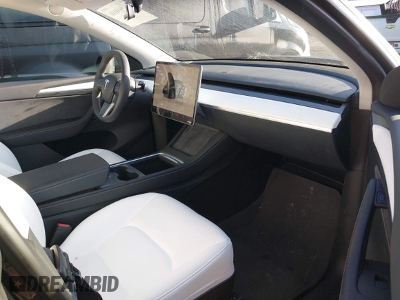 2023 Tesla Model Y Long Range z VIN 7SAYGDEE9PF637042, wystawiony jako IAAI lot #41969086 z przebiegiem 25 524 mil mil oraz . Historia ofert i sprzedaży dostępna na DreamBid. Obrazek 5.
