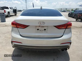 2018 Hyundai Elantra Sport с VIN KMHD04LB8JU556486, выставлен на аукционе Copart как лот 58772815 с пробегом 105 307 миль миль и Списание • Salvage title. История ставок и продаж доступна на DreamBid. Изображение 6.