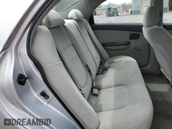2004 Kia Spectra LX with VIN KNAFE121245031019, listed as a Copart auction lot 52960135 with 183,016 mi miles and Salvage Title. Bid and sale history available at carsss.com. Image 10.