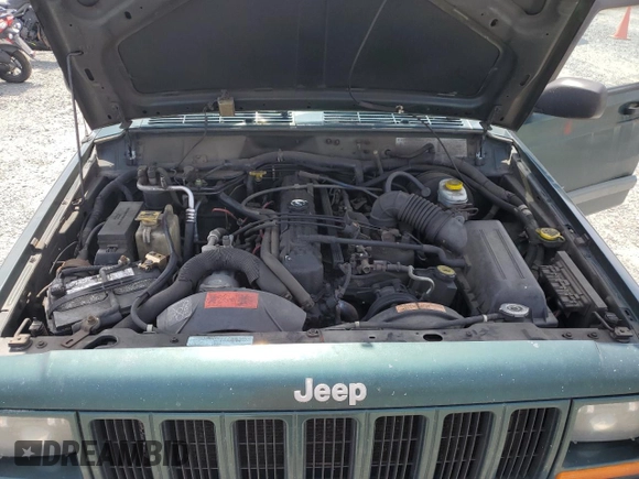 1999 Jeep Cherokee Sport with VIN 1J4FF68S2XL570795, listed as a Copart auction lot 61860585 with 320,467 mi miles and Salvage title. Bid and sale history available at DreamBid. Image 12.