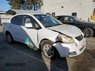 2011 Suzuki SX4 LE with VIN JS2YC5A21B6300207, listed as a Copart auction lot 77040354 with 162,915 mi miles and Salvage Title. Bid and sale history available at carsss.com. Image 4.