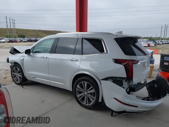 2024 Cadillac XT6 Premium Luxury z VIN 1GYKPERS5RZ741592, wystawiony jako IAAI lot #41327267 z przebiegiem 5 889 mil mil oraz . Historia ofert i sprzedaży dostępna na DreamBid. Obrazek 15.