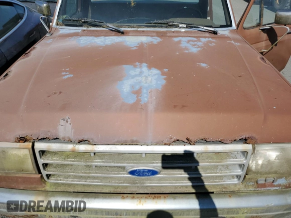 1991 Ford F-150 with VIN 1FTDF15Y5MPA38972, listed as a Copart auction lot 64475054 with 86,748 mi miles and Salvage Title. Bid and sale history available at carsss.com. Image 11.