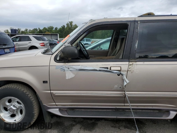 1997 Ford Explorer XLT with VIN 1FMDU35PXVZB69793, listed as a Copart auction lot 70712774 with 138,243 mi miles and Salvage title. Bid and sale history available at DreamBid. Image 7.