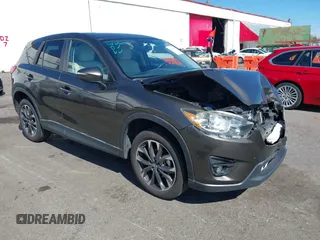 2016 Mazda CX-5 Grand Touring with VIN JM3KE2DYXG0773663, listed as a IAAI auction lot 41896367 with 86,571 mi miles and . Bid and sale history available at DreamBid. Image 1.